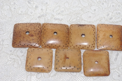 **MBAMG #T06-162  "1980's Set Of 7 Large Hand Made Bone Buttons"