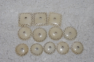 **MBAMG #T06-171  "1980's Set of 9 Hand Made Bone Buttons"
