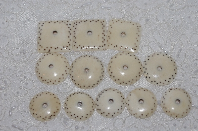 **MBAMG #T06-171  "1980's Set of 9 Hand Made Bone Buttons"