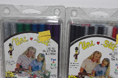 +MBAMG #009-389  "2 Sets Of Uni-Stik Glitter Glue Sticks"