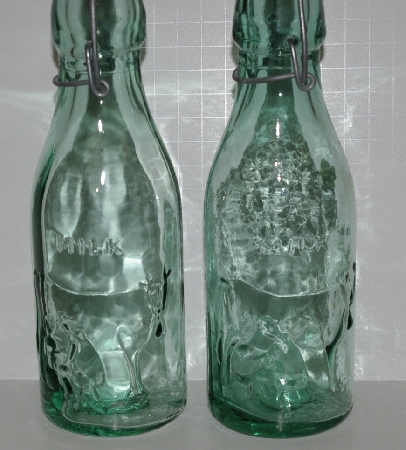 +MBA #2727-559   " Set Of (2) 2003 Riekes Spanish Green Glass Milk Bottles""