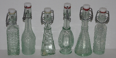 +MBA #2727-476  "1990's Set Of 6 Fancy Mini Clear Glass Bottles With Stoppers"