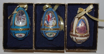 MBA #3535-623   "Set Of 3 Handcrafted Porcelain Christmas Themed Egg Ornaments"