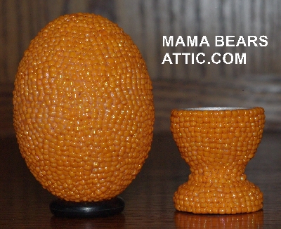 +MBA #4242-1638  "Opaque Luster Orange Glass Seed Bead Egg With Matching Egg Cup"