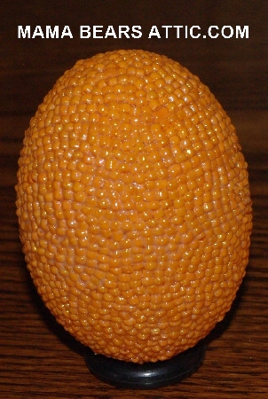 +MBA #4242-1638  "Opaque Luster Orange Glass Seed Bead Egg With Matching Egg Cup"