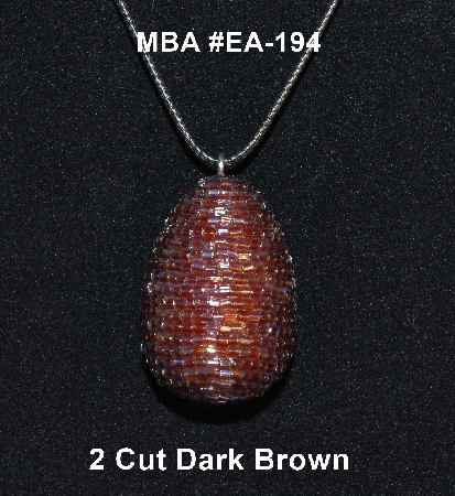+MBA #EA-194  "2 Cut Brown Glass Seed Bead Egg Pendant"