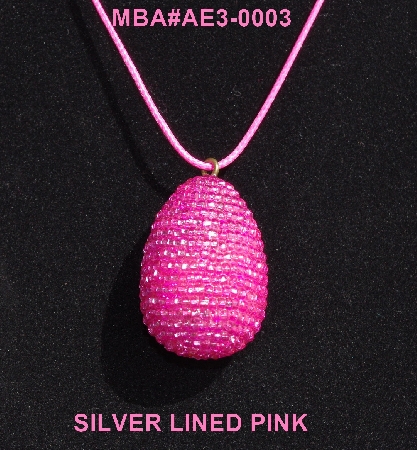 +MBA #AE3-0003  "Silver Lined Pink Glass Seed Bead Egg Pendant"