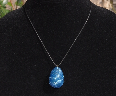 +MBA #AE3-0082  "Silver Lined Blue Glass Seed Bead Egg Pendant"