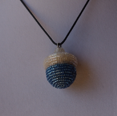 +MBA #AC1-0093  "Clear Luster & Silver Lined Blue Glass Seed Bead Acorn Pendant"