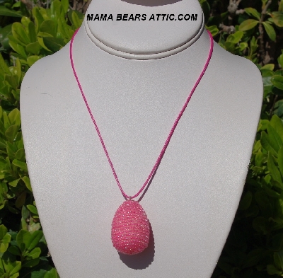 +MBA #5557-0040  "Bright Pink Lined Glass Seed Bead Egg Pendant"