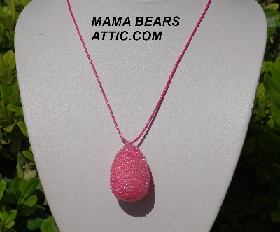 +MBA #5557-0040  "Bright Pink Lined Glass Seed Bead Egg Pendant"