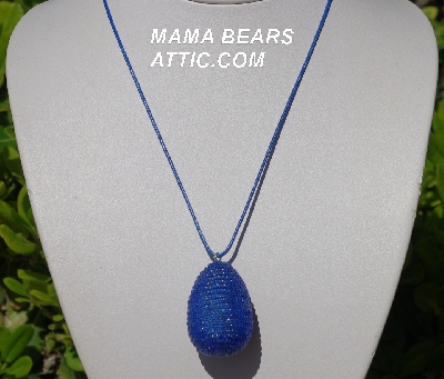 +MBA #5557-0049  "Luster Blue Glass Seed Bead Egg Pendant"