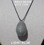 +MBA #5557-0056  "Light Blue Glass Seed Bead Egg Pendant"