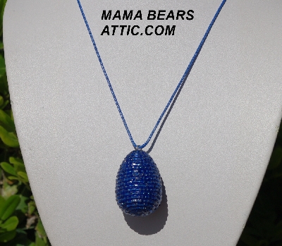 +MBA #5557-0063  "2 Cut Dark Blue Glass Seed Bead Egg Pendant"