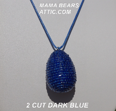 +MBA #5557-0063  "2 Cut Dark Blue Glass Seed Bead Egg Pendant"
