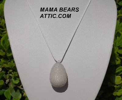 +MBA #5557-0084  "Pearl White Glass Seed Bead Egg Pendant"