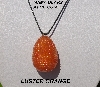 +MBA #5557-0091  "Luster Orange Glass Seed Bead Egg Pendant"