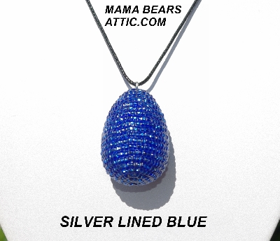 +MBA #5555-0091  "Silver Lined Blue Glass Seed Bead Egg Pendant"