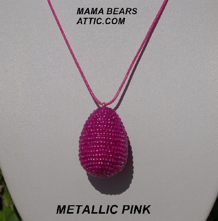 +MBA #5557-105  "Metallic Pink Glass Seed Bead Egg Pendant"