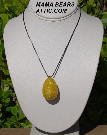 +MBA #5557-162  "3 Cut Yellow Glass Seed Bead Egg Pendant"