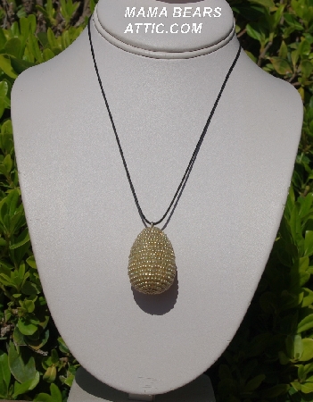 +MBA #5557-196  "Metallic Gold Glass Seed Bead Egg Pendant"