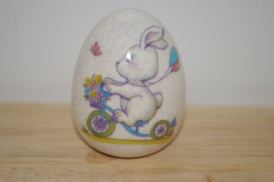 +MBA #10-037  1980's MBA #10-037  Porceline Cracked Finish Bunny On A Bike Egg