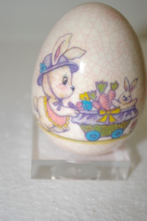 +MBA #11-195   1980's Porceline Cracked Finish Bunny On A Bike Egg
