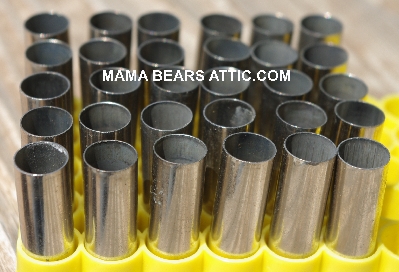 MBA #5626B-1999  "1990's Set Of (30) S&W 357 Magnum Nickel Spent Shell Casings"