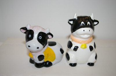 +MBA #33-141  "Pair Of Black & White Cows With Yellow Bows Salt & Pepper Shakers