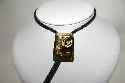 +MBA #81-132  "Gold Plated Black Enamel Double Horseshoe Bolo Tie