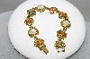 +MBA #96-077 "ART Goldtone Multi Colored Stone Fancy Bracelet"