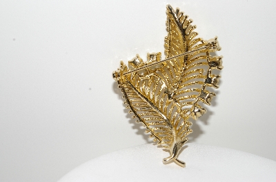 +MBA #99-057  "Lisner Goldtone Peacock Colored Crystal Leaf Pin"