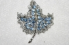 **MBA #E50-157   "Vintage Silvertone Blue Crystal Rhinestone Leaf Pin"