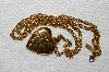 +MBA #E53-256   "Older 1928 Gold Tone Heart Locket  With 28" Chain"