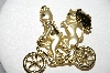 **MBA #E51-164   "AJC Gold Tone Fancy Cats On A Bike Pin"