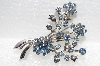 **MBA #E56-003   "Vintage Silvertone Blue Crystal Rhinestone Fancy Flower Pin"