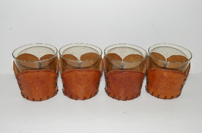 +MBA #S28- 233   "Set Of 4 Amber Glass Tumblers With Hand Tooled Leather Drink Holders"