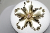 +MBA #88-593  "Gold Tone Fancy Flower Brooch With AB Crystal Rhinestone Center"