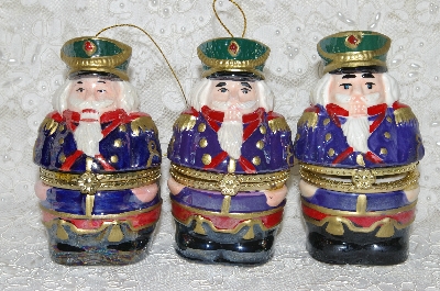 +MBA #SG9-102    "Mr. Christmas Set Of 3 Porcelain Nutcracker Animated Music Box Ornaments"